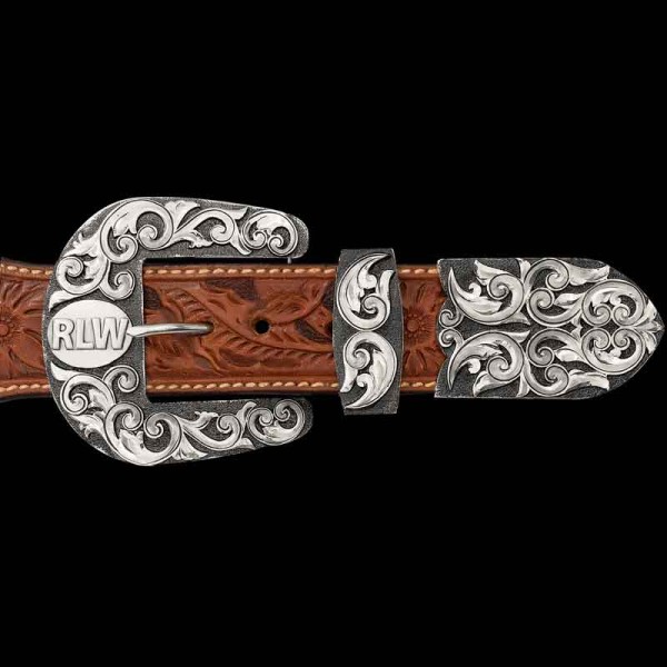 "Built to last, just like the cowboy and cowgirl who wear it—timeless through and through. Our Rockford Custom 3-Piece Buckle Set is expertly hand-engraved on a German Silver base, featuring a dark background and our signature antique finish. The mai
